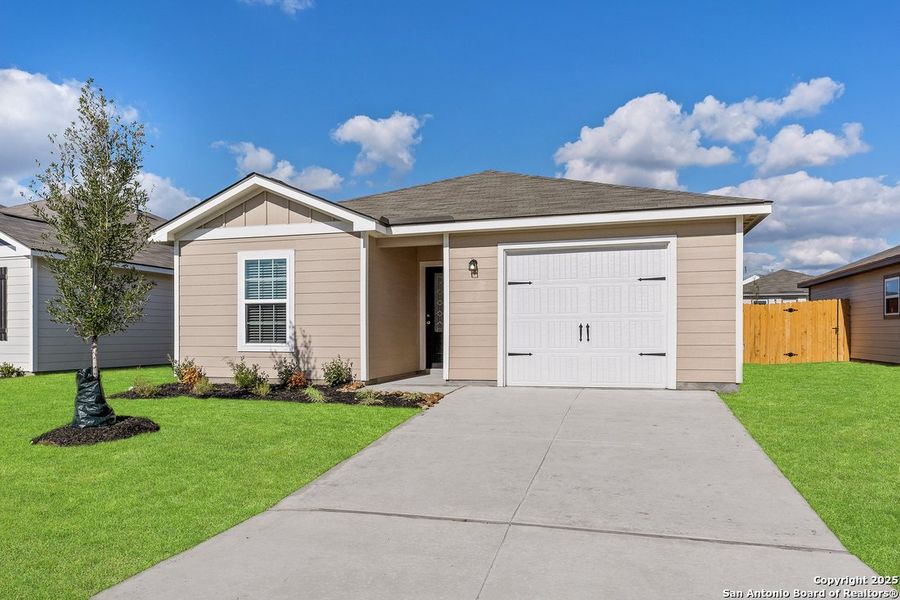 Front exterior of a new home in Savannah Place, San Antonio, TX, highlighting curb appeal (Image 2). Front exterior of a new home in Savannah Place, San Antonio, TX, highlighting curb appeal (Image 2).