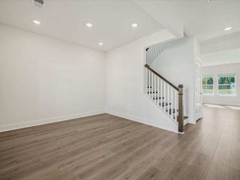 Spacious, unfurnished interior of a new home in The Coves at Lakes of Cane Bay II, Summerville (Image 22).
