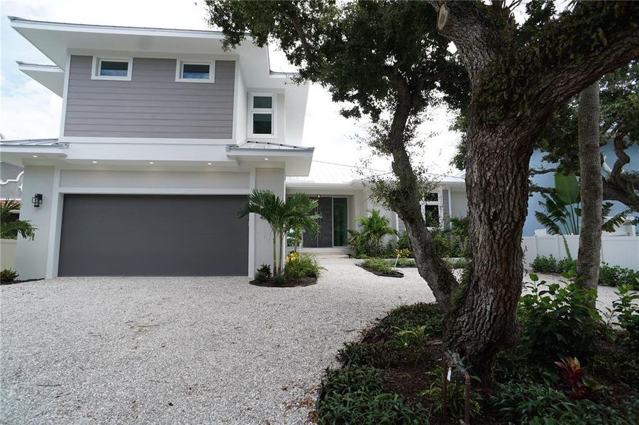Front exterior of a new home in , Sarasota, FL, highlighting curb appeal (Image 2). Front exterior of a new home in , Sarasota, FL, highlighting curb appeal (Image 2).