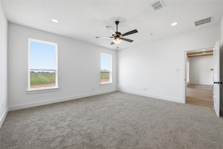 Unfurnished room with carpet, recessed lighting, and a ceiling fan Unfurnished room with carpet, recessed lighting, and a ceiling fan