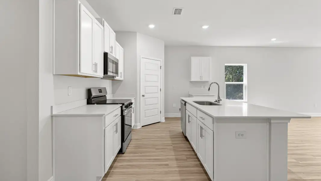 Furnished interior view inside a new home in Ashton Park Phase III, Freeport (Image 4).