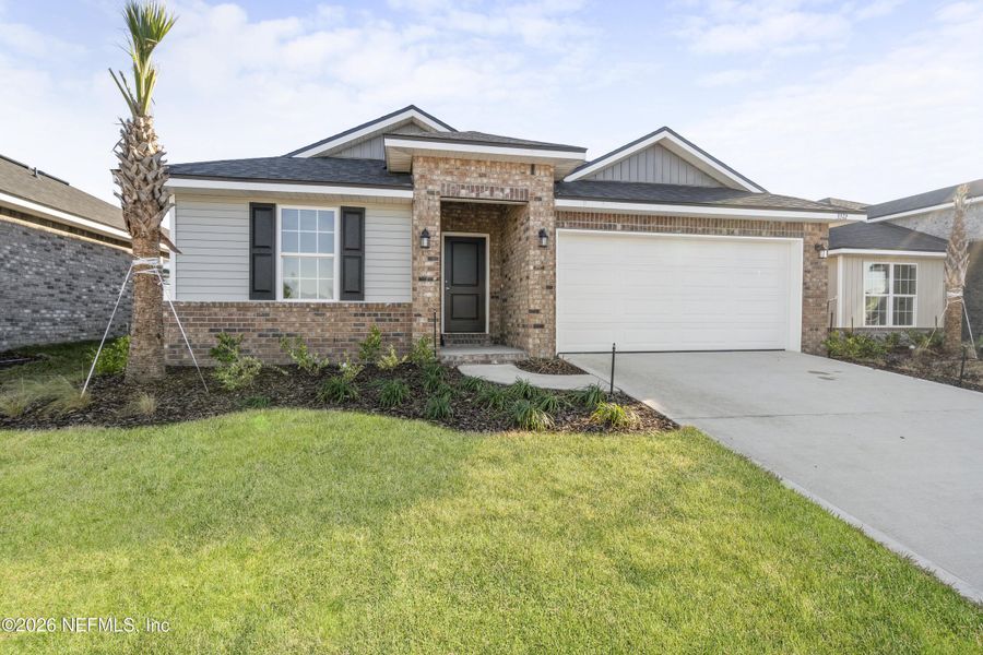 Front exterior of a new home in Shadow Crest at Rolling Hills, Green Cove Springs, FL, highlighting curb appeal (Image 16).