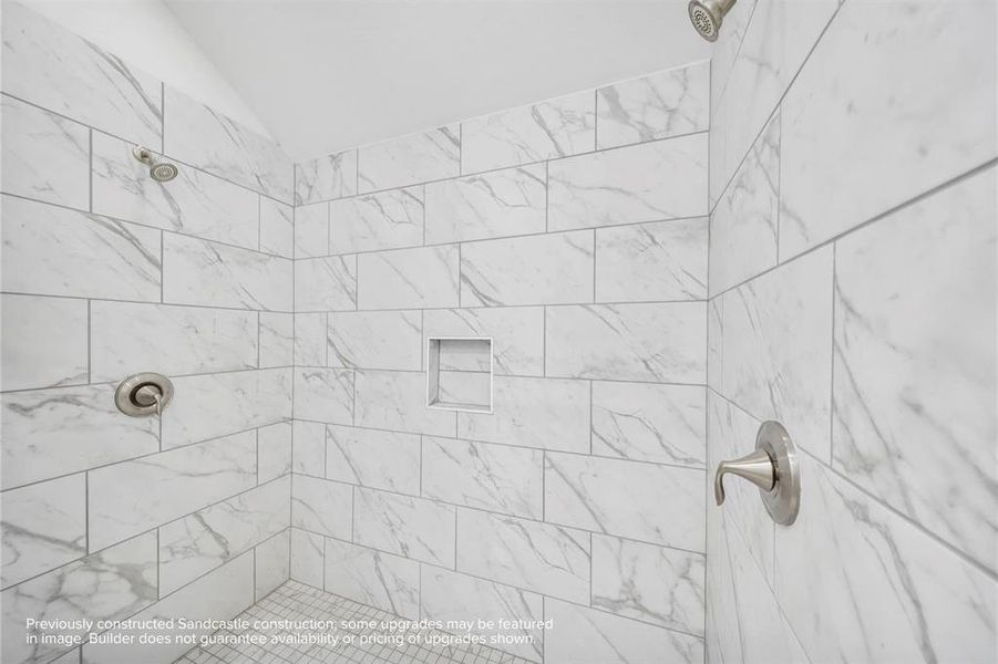 Shower in Style: Revel in the expansiveness of a large shower, standard with sleek finishes and dual shower heads, providing plenty of space for shared morning routines.