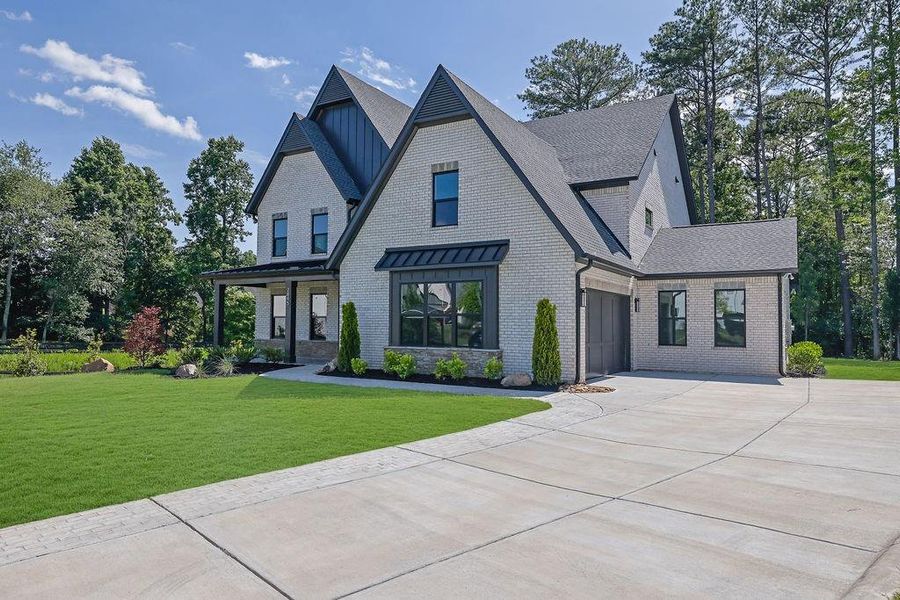 Front exterior of a new home in , Cumming, GA, highlighting curb appeal (Image 2). Front exterior of a new home in , Cumming, GA, highlighting curb appeal (Image 2).