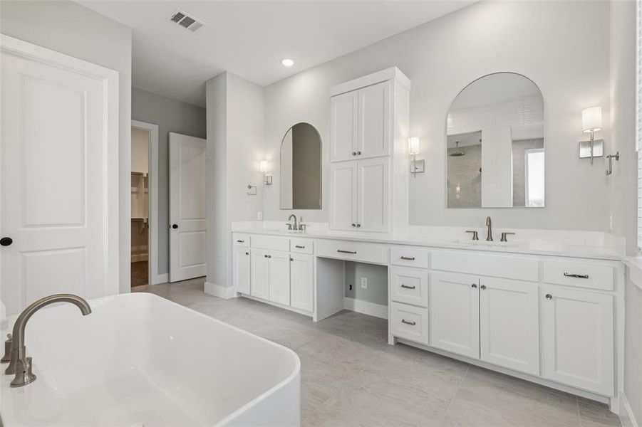 No shortage of space or style in this dream owner's bath designed with two in mind! No shortage of space or style in this dream owner's bath designed with two in mind!