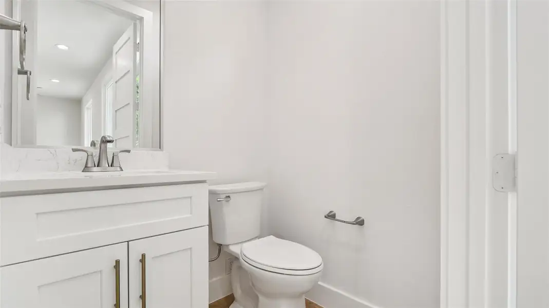 Half bathroom with vanity and recessed lighting Half bathroom with vanity and recessed lighting