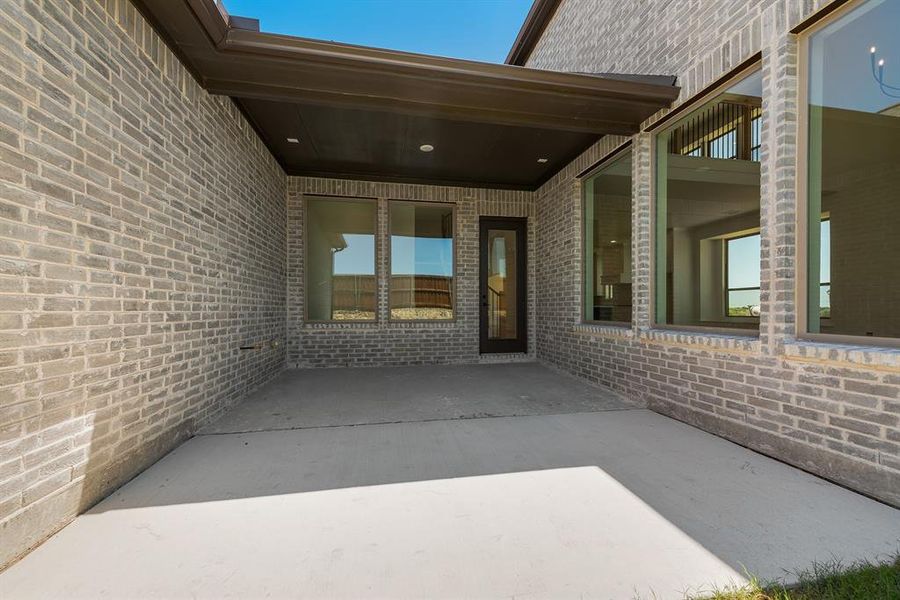 Exterior details and patio area of a home in The Homestead - 62', Rockwall (Image 25).