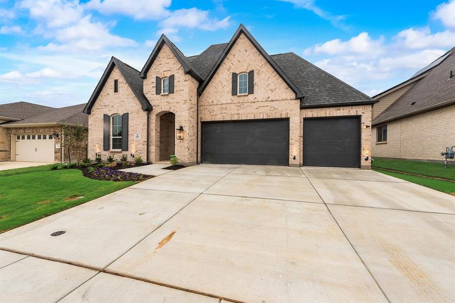 Front exterior of a new home in Tavolo Park, Fort Worth, TX, highlighting curb appeal (Image 19).