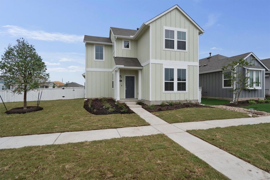 Front exterior of a new home in Casetta Ranch, Kyle, TX, highlighting curb appeal (Image 17). Front exterior of a new home in Casetta Ranch, Kyle, TX, highlighting curb appeal (Image 17).