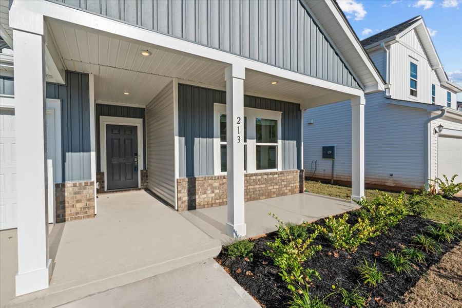 Exterior details and patio area of a home in The Farm at Wells Creek - Signature Collection, Gray Court (Image 2).