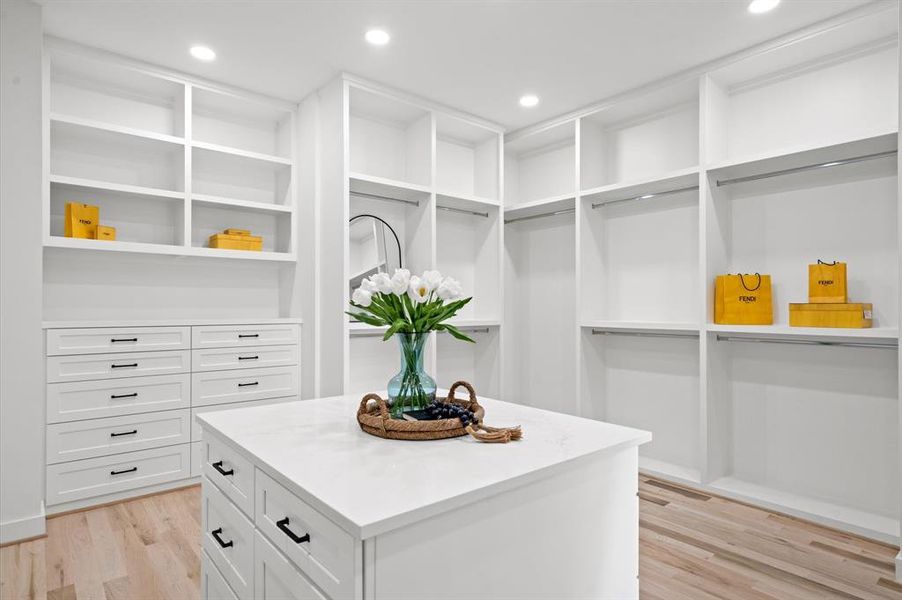 Alternative view: Oversized primary closet with center island with additional drawers.