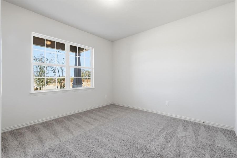 Unfurnished room with carpet floors and baseboards