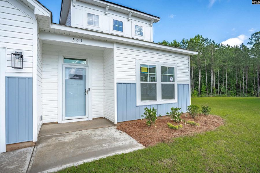 Front exterior of a new home in Rolling Hills, Prosperity, SC, highlighting curb appeal (Image 25).