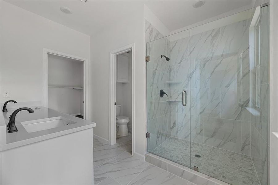 Primary bathroom with HUGE shower and lots of natural lighting Primary bathroom with HUGE shower and lots of natural lighting