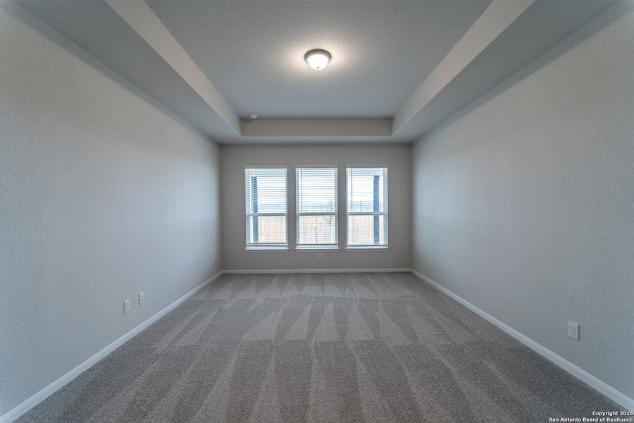 Spacious, unfurnished interior of a new home in The Woodlands at Medina Hills, Mico (Image 22).