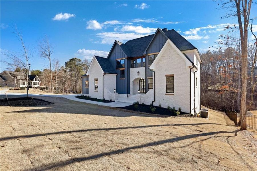 Front exterior of a new home in , Gainesville, GA, highlighting curb appeal (Image 28).
