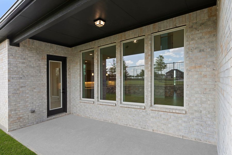 Exterior details and patio area of a home in Nelson Lake Estates, Rockwall (Image 21).