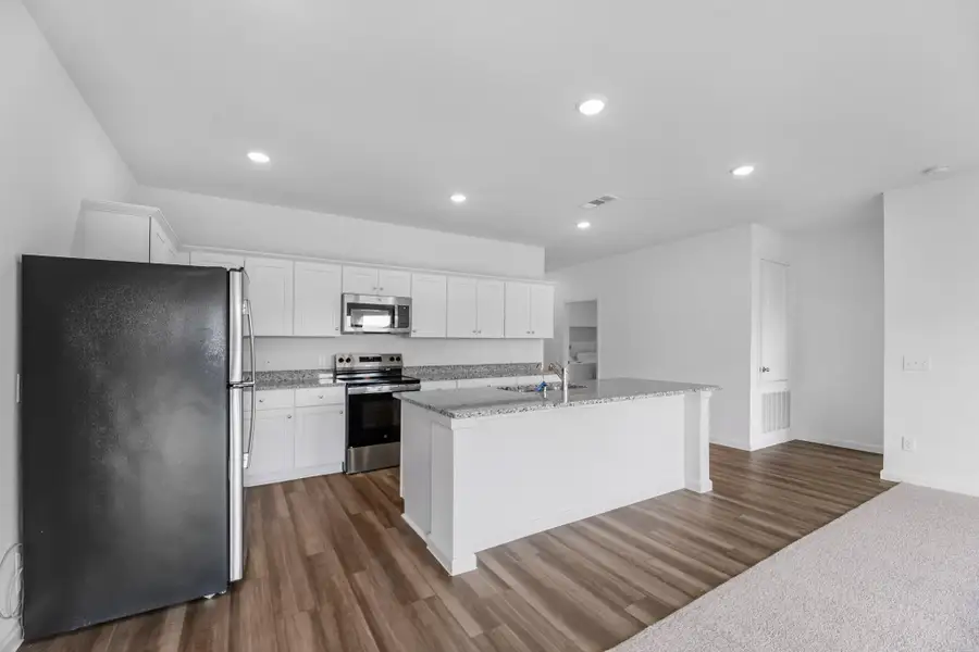 Furnished interior view inside a new home in Royal Pines, Porter (Image 8).