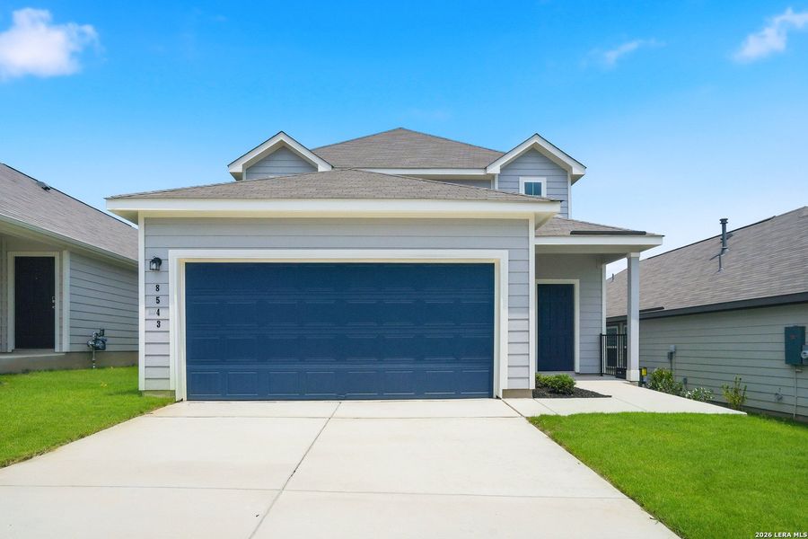 Front exterior of a new home in Hickory Ridge, Elmendorf, TX, highlighting curb appeal (Image 2). Front exterior of a new home in Hickory Ridge, Elmendorf, TX, highlighting curb appeal (Image 2).