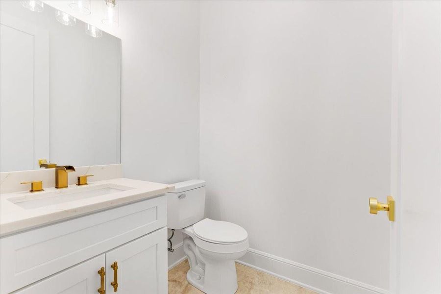 bathroom featuring a modern vanity and updated finishes. bathroom featuring a modern vanity and updated finishes.