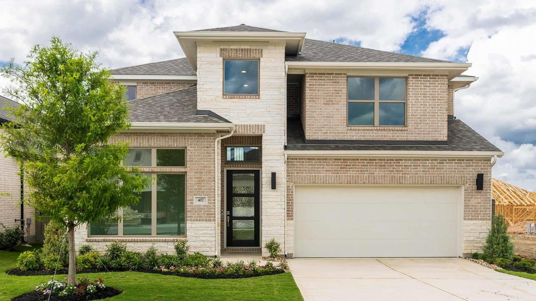 View of front of property with roof with shingles, concrete driveway, a garage, a front yard, and brick siding View of front of property with roof with shingles, concrete driveway, a garage, a front yard, and brick siding
