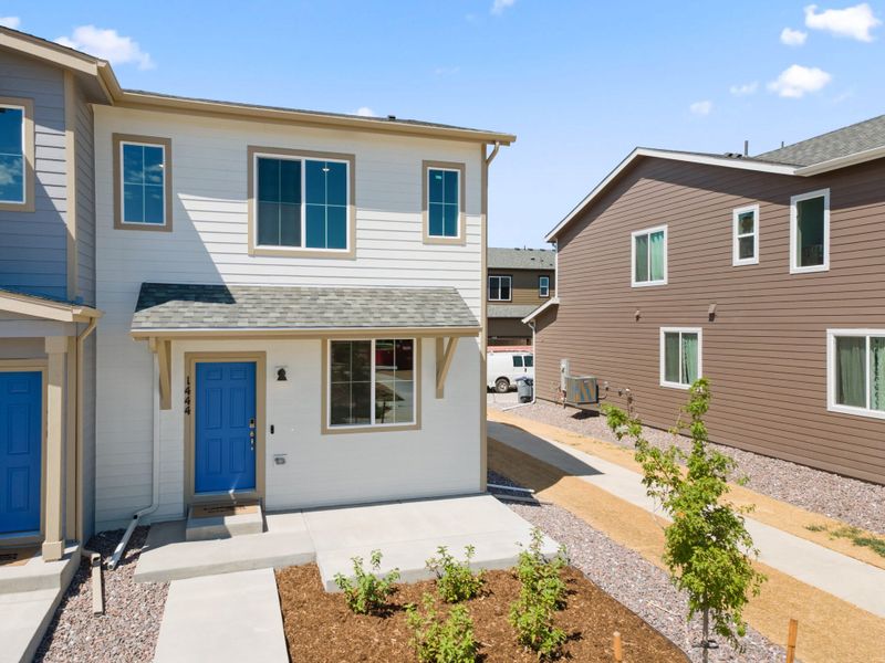 Front exterior of a new home in Spring Valley, Longmont, CO, highlighting curb appeal (Image 2).