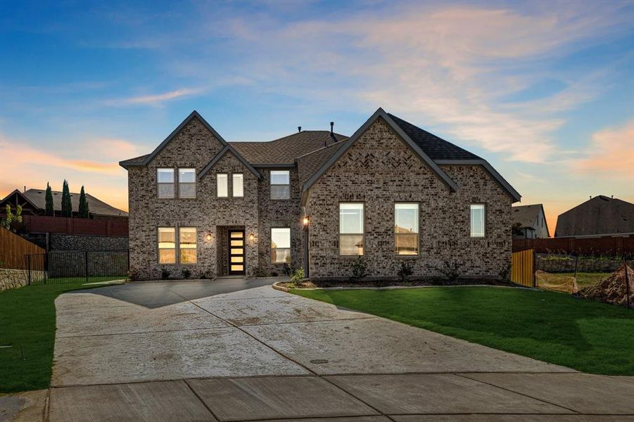 Front exterior of a new home in The Enclave at Parks of Aledo, Aledo, TX, highlighting curb appeal (Image 21). Front exterior of a new home in The Enclave at Parks of Aledo, Aledo, TX, highlighting curb appeal (Image 21).