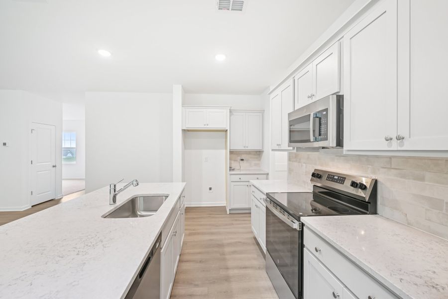 Representative furnished interior of a home built from the Brooke by Ashton Woods in Middleton Farms, Middlesex (Image 5).