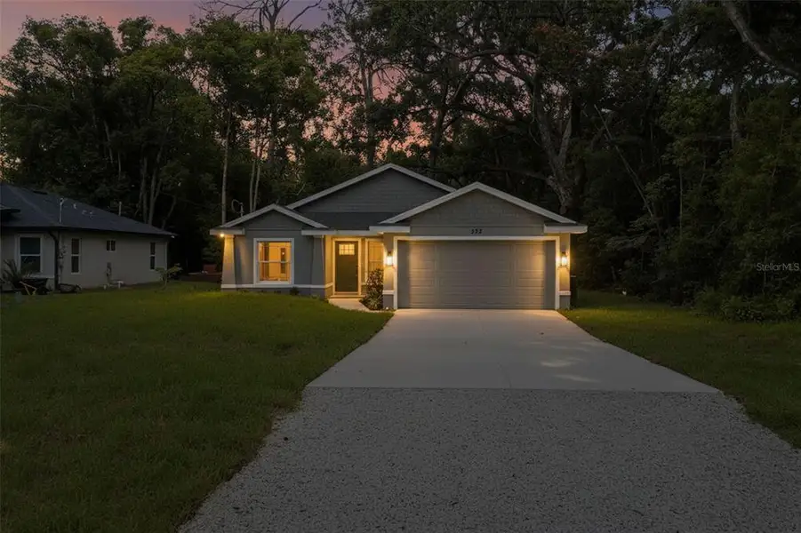 Front exterior of a new home in , Masaryktown, FL, highlighting curb appeal (Image 28).