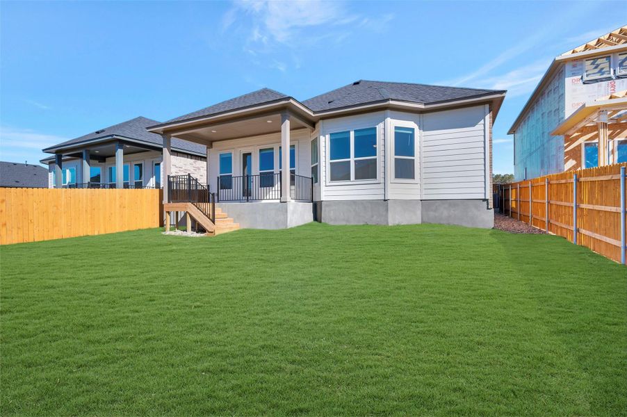 Exterior details and patio area of a home in Heritage, Dripping Springs (Image 4).