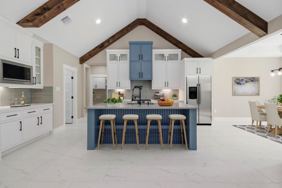 Virtually Staged: The ultimate gathering hub, this open-concept kitchen features a massive center island with breakfast bar seating, soaring vaulted ceilings with exposed timber beams, and custom cabinetry. Virtually Staged: The ultimate gathering hub, this open-concept kitchen features a massive center island with breakfast bar seating, soaring vaulted ceilings with exposed timber beams, and custom cabinetry.