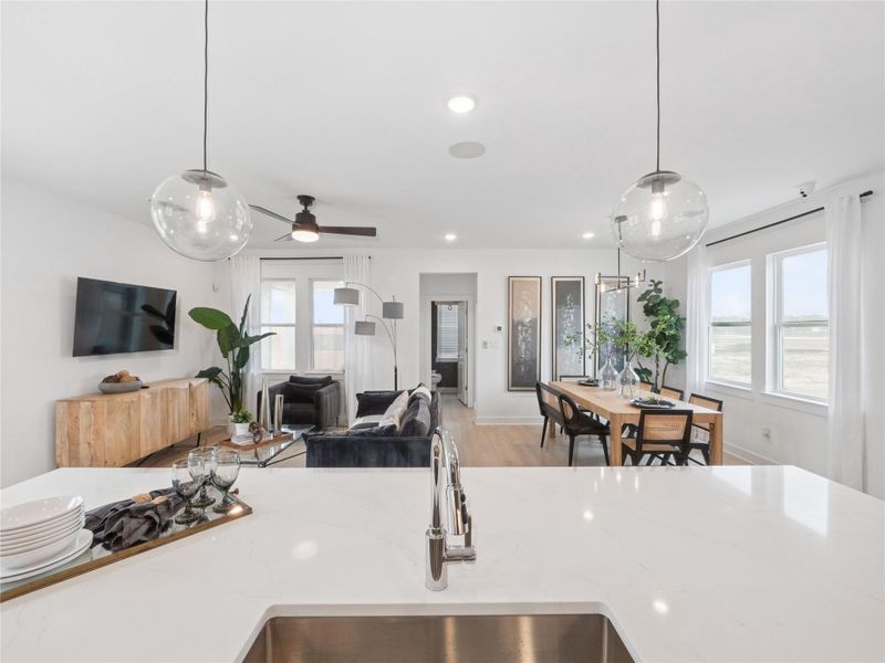 Kitchen open to the dining area and great room (*Photo not of actual home and used for illustration purposes only.)
