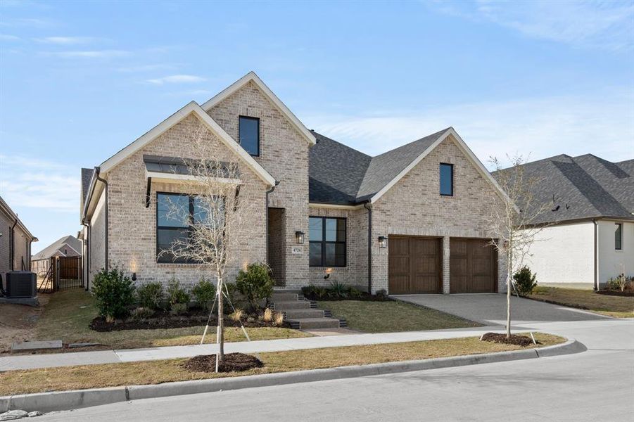 Front exterior of a new home in Viridian Elements, Arlington, TX, highlighting curb appeal (Image 21).