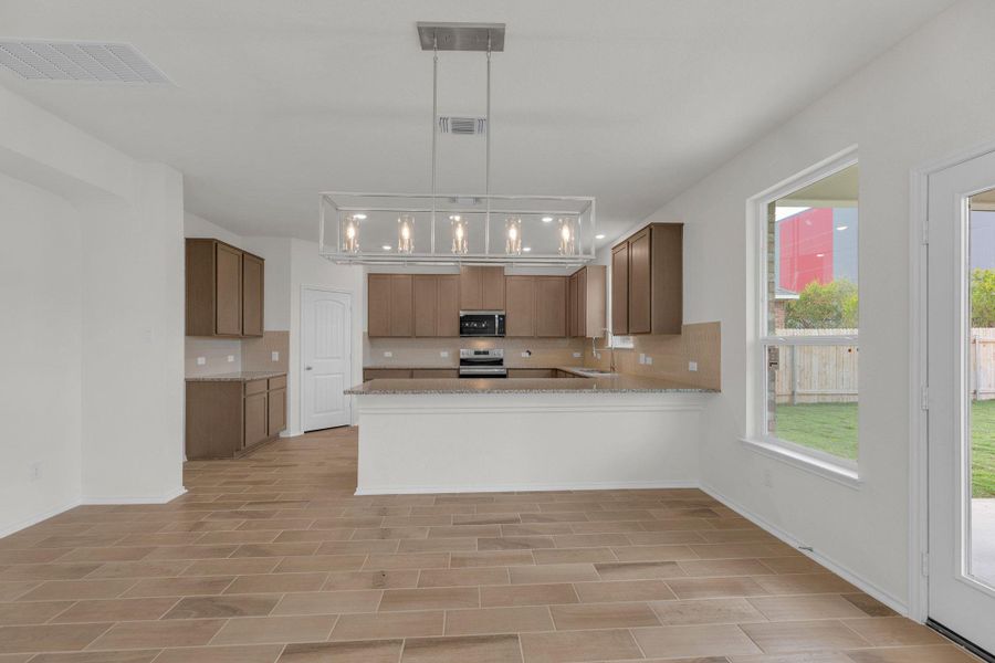 Furnished interior view inside a new home in Mustang Valley, Manor (Image 15).