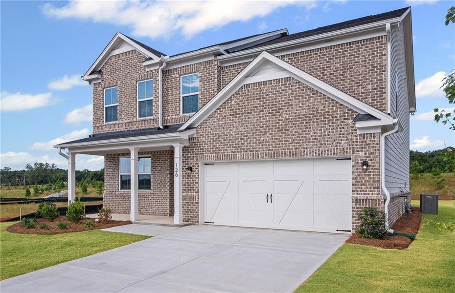 Front exterior of a new home in Overland, Locust Grove, GA, highlighting curb appeal (Image 2). Front exterior of a new home in Overland, Locust Grove, GA, highlighting curb appeal (Image 2).