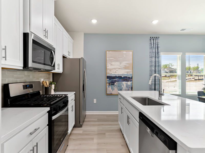 Furnished interior view inside a new home in Cadence Meadows Townes, Zebulon (Image 6). Furnished interior view inside a new home in Cadence Meadows Townes, Zebulon (Image 6).