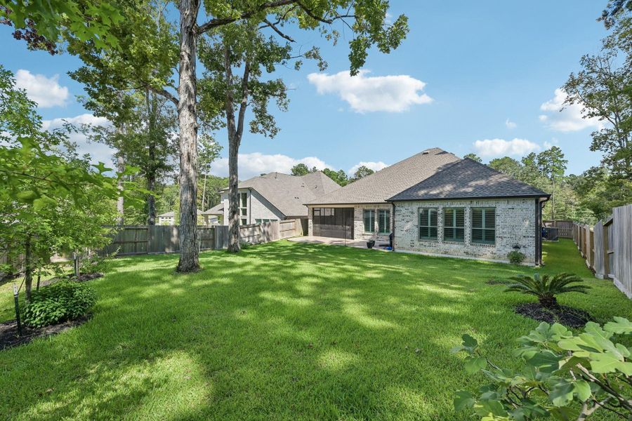 Exterior details and patio area of a home in The Woodlands Hills, Willis (Image 25).