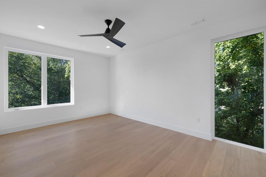 Spare room with plenty of natural light, recessed lighting, light wood-style floors, and ceiling fan Spare room with plenty of natural light, recessed lighting, light wood-style floors, and ceiling fan