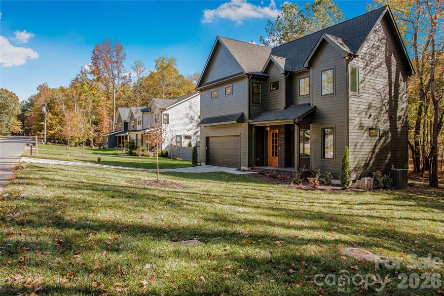 Front exterior of a new home in , Matthews, NC, highlighting curb appeal (Image 24).