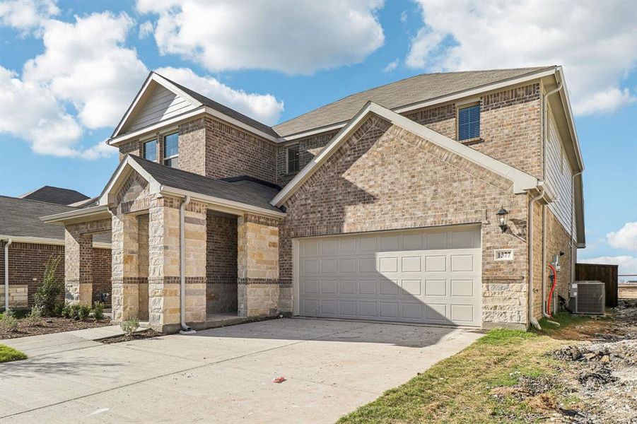 Front exterior of a new home in River Ridge, Crandall, TX, highlighting curb appeal (Image 2). Front exterior of a new home in River Ridge, Crandall, TX, highlighting curb appeal (Image 2).