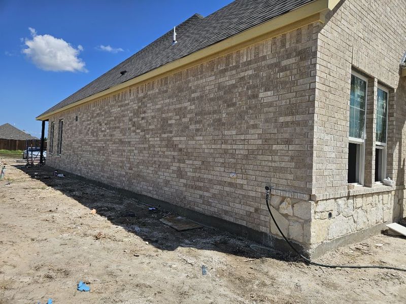 Front exterior of a new home in Aero Vista, Caddo Mills, TX, highlighting curb appeal (Image 11).