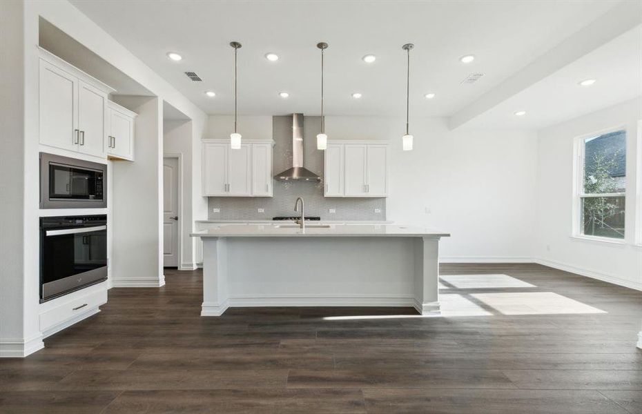 Airy kitchen with oversized island  *real home pictured