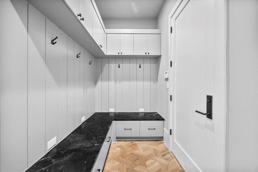 Mud Room off of one of the Two Car Garages. 4 Car Garage Total.