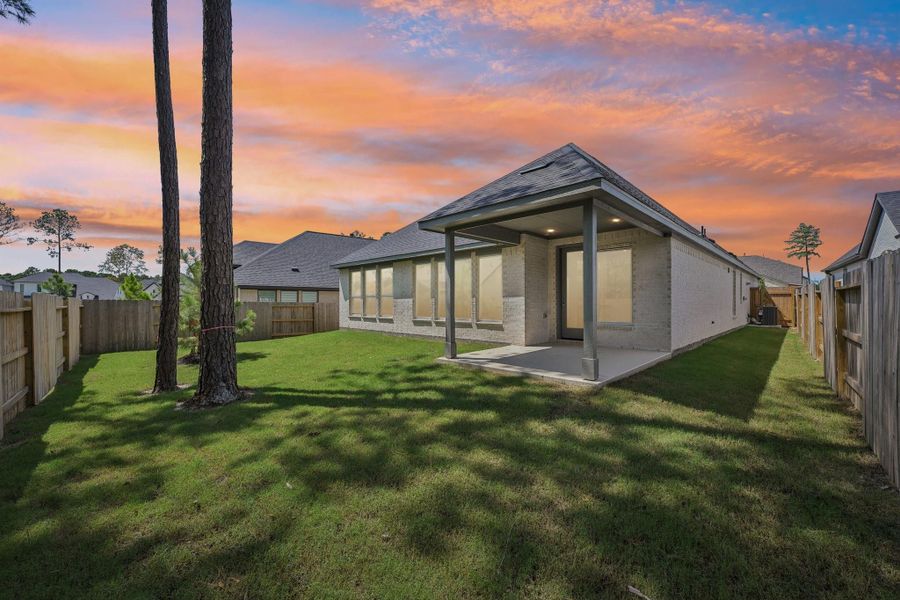 Exterior details and patio area of a home in Woodhavyn 50', Magnolia (Image 3).