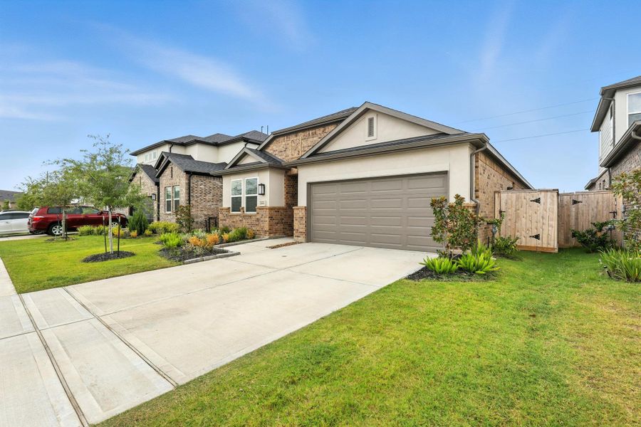 Front exterior of a new home in Bridge Creek 45s and 50s, Cypress, TX, highlighting curb appeal (Image 2). Front exterior of a new home in Bridge Creek 45s and 50s, Cypress, TX, highlighting curb appeal (Image 2).