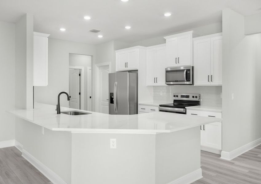 The kitchen has plenty of counterspace to create your family's favorite meals