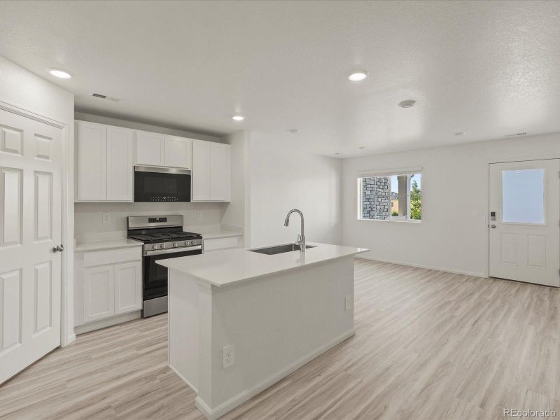 Furnished interior view inside a new home in Skyview at High Point, Aurora (Image 7).