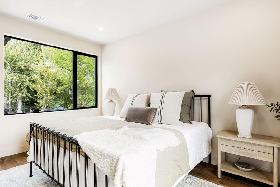 Bedroom featuring wood finished floors and recessed lighting