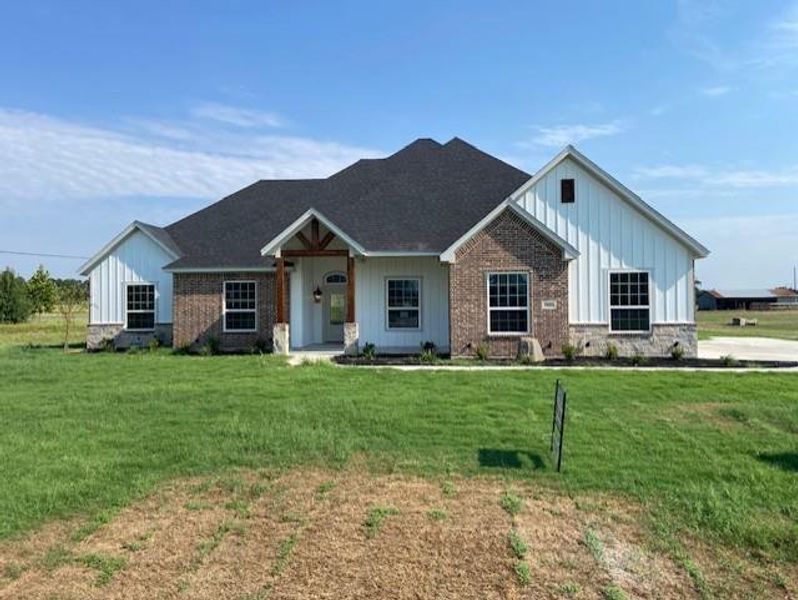 Front exterior of a new home in , Reno, TX, highlighting curb appeal (Image 2).