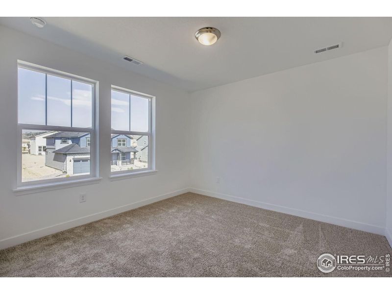 Spacious, unfurnished interior of a new home in Riano Ridge, Loveland (Image 16).
